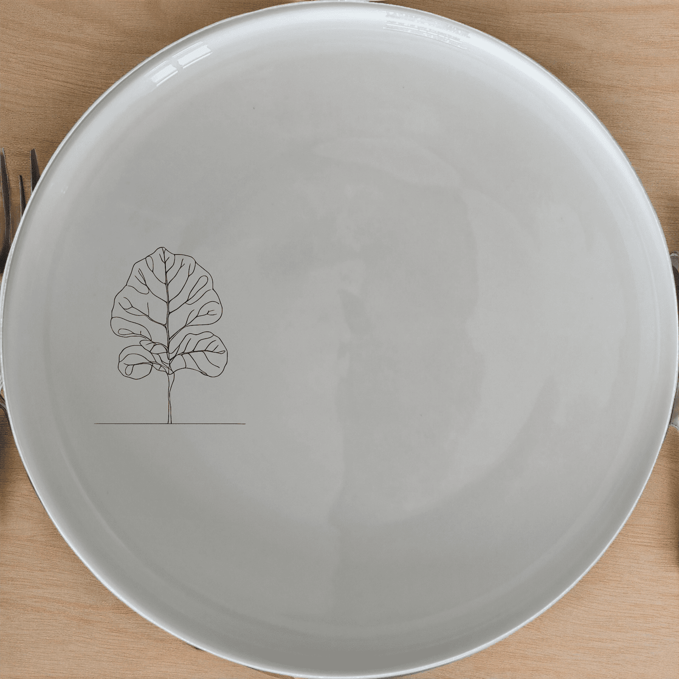 The Fiddle Leaf Dinner Plate Set of 4 brings a touch of nature to your dining table with its elegant leaf design.
