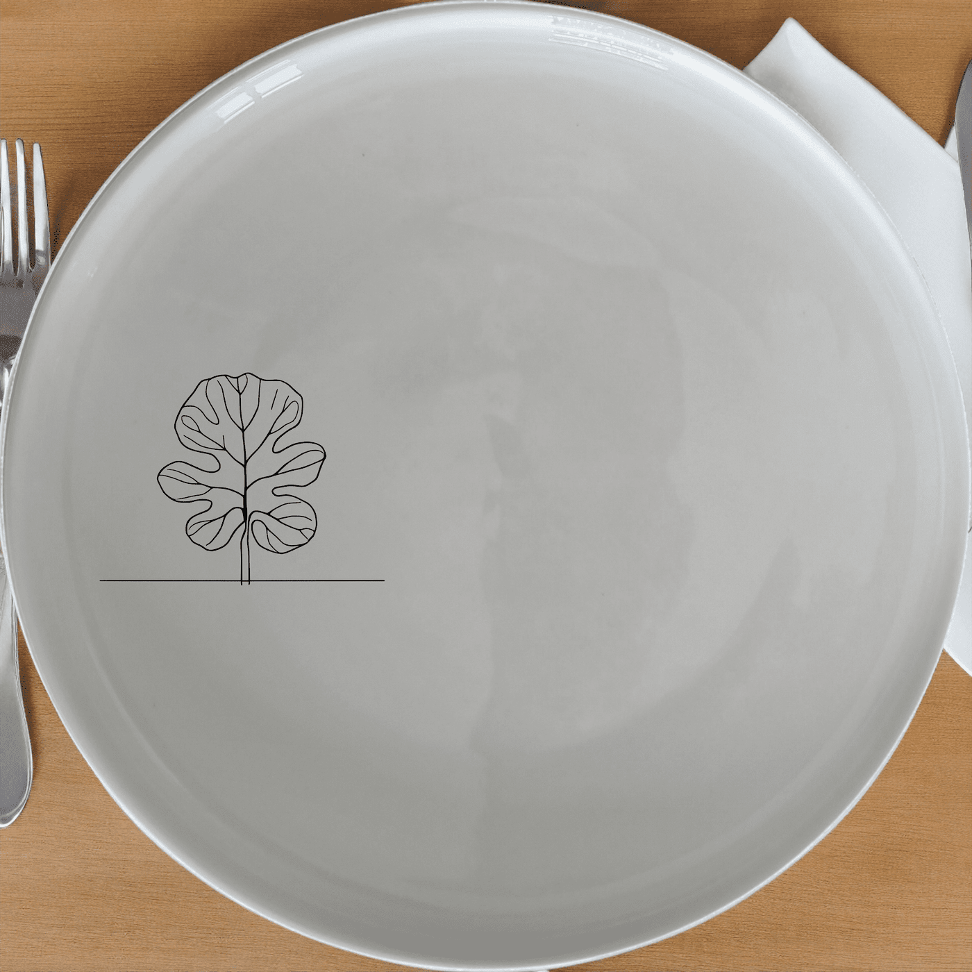 The Fiddle Leaf Side Plate Set of 4 features a minimalist design with an elegant leaf motif, perfect for modern dining.