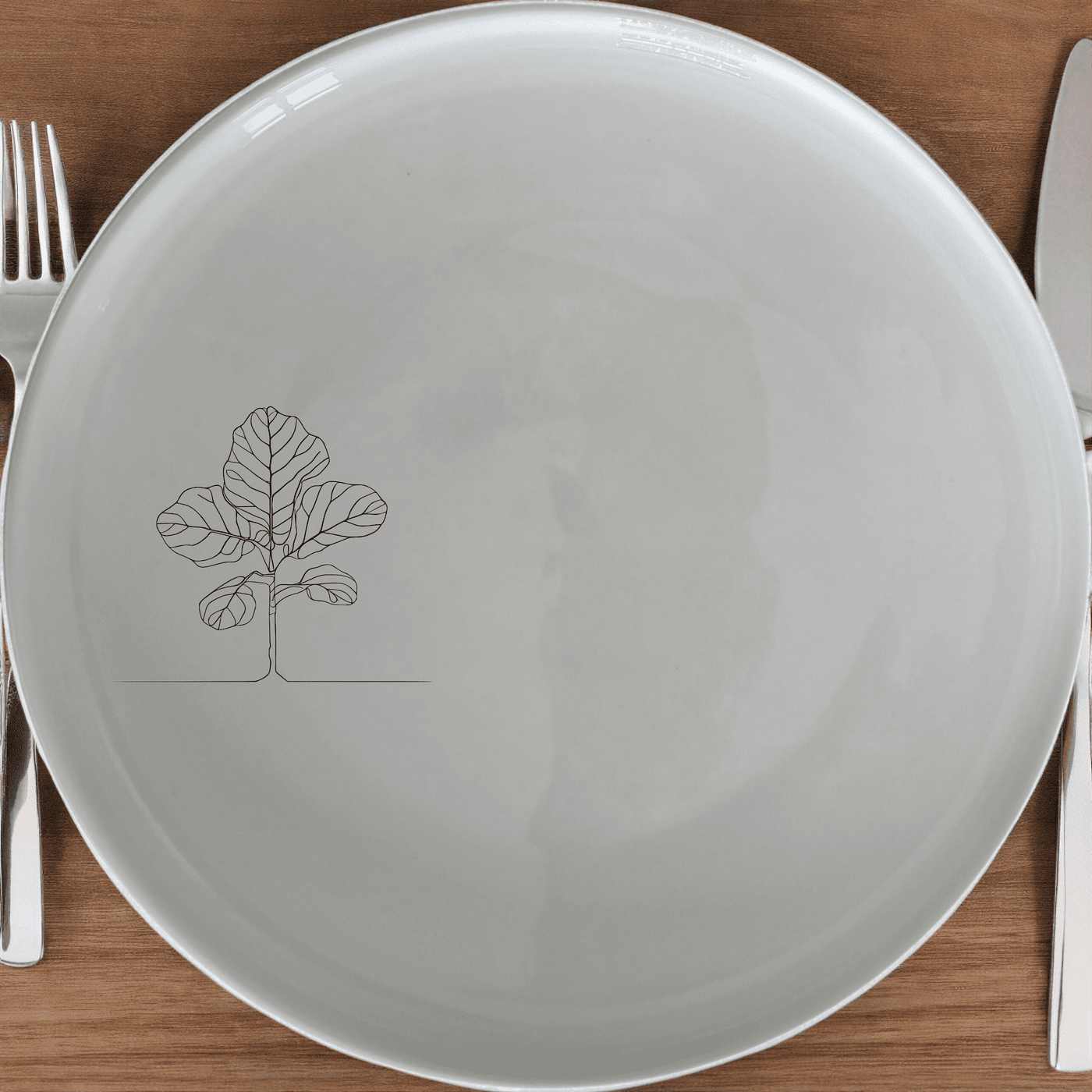 Fiddle Leaf Fig Side Plate Set of 4 offers a modern, minimalist design perfect for contemporary dining. This set of four plates features a subtle leaf motif, adding a touch of nature to your table setting.