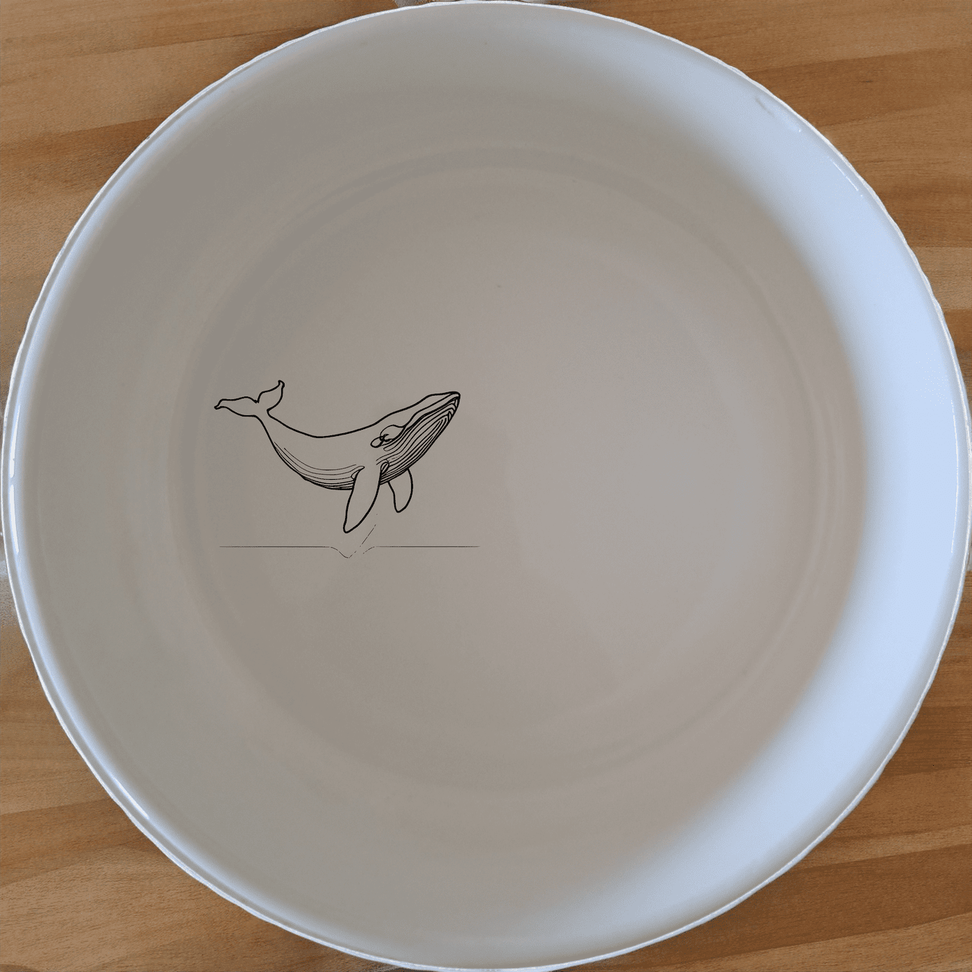 The Floating Breaching Whale Bowl Set of 4 features elegant whale designs, perfect for any dining table.