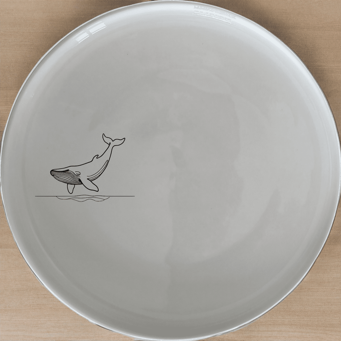 Floating Breaching Whale Dinner Plate Set of 4 adds a touch of marine elegance to your dining table with sleek, minimalist design.