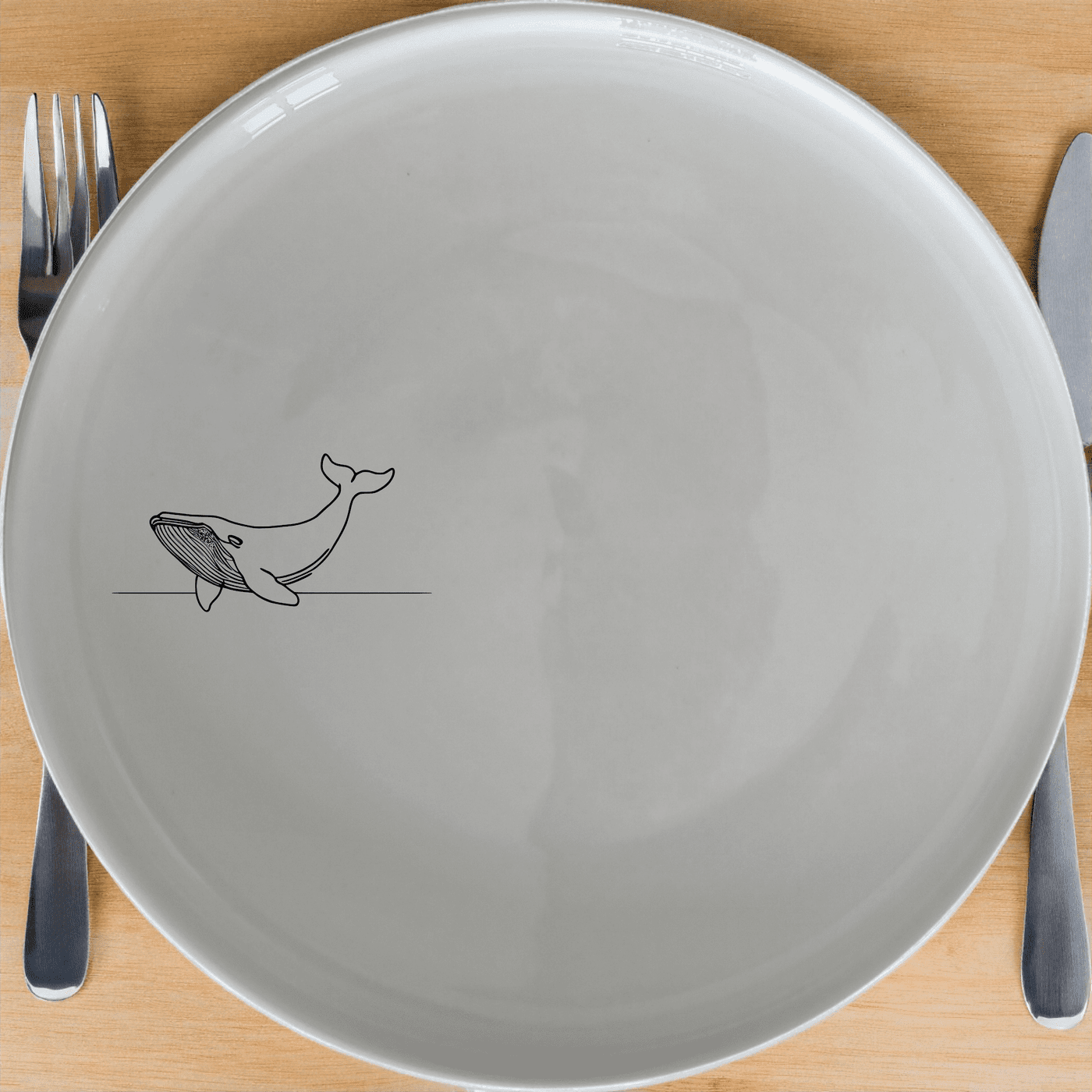 The Floating Breaching Whale Side Plate Set of 4 features a sleek, minimalist design perfect for modern dining. Crafted from premium ceramic, these plates are both functional and stylish.