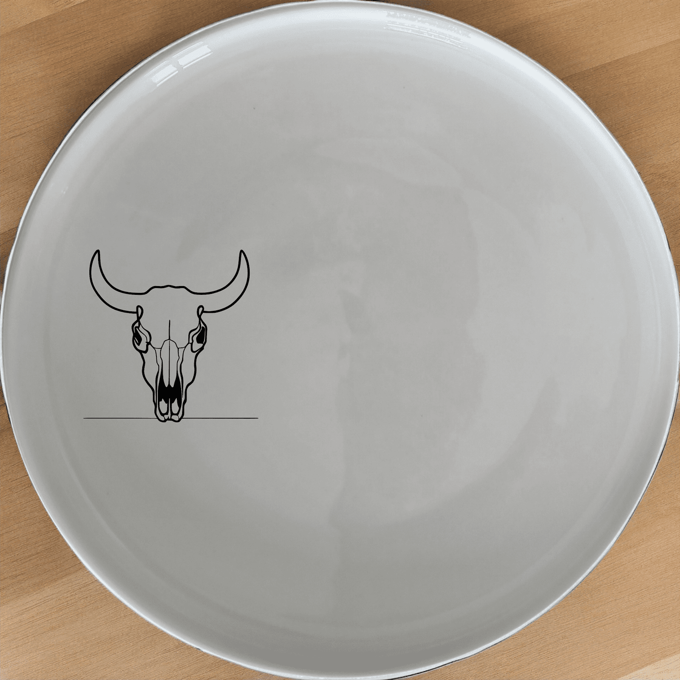 The Frontfacing Cow Skull Dinner Plate Set of 4 adds a bold, artistic touch to your dining experience with its striking skull design.