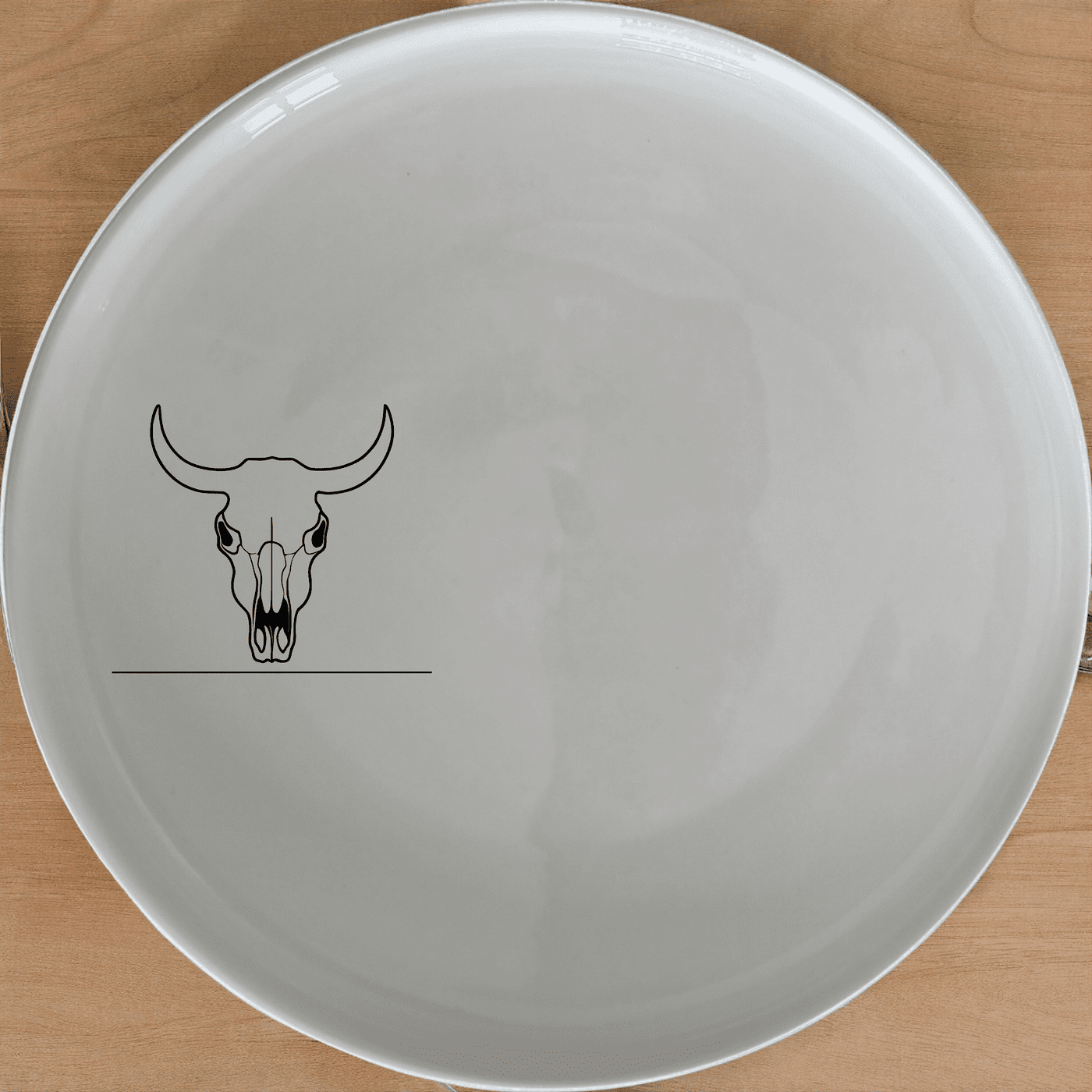 Frontfacing Cow Skull Dinner Plate Set of 4 is a stylish and modern dinner plate set featuring a unique skull design.