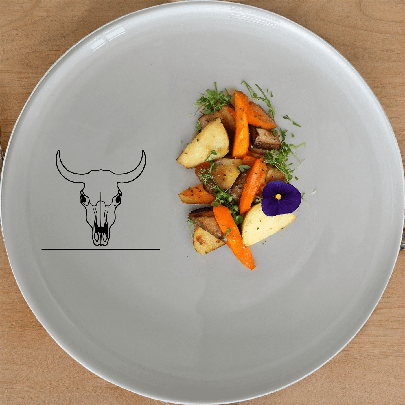 Frontfacing Cow Skull Dinner Plate Set of 4 is a stylish and modern dinner plate set featuring a unique skull design.