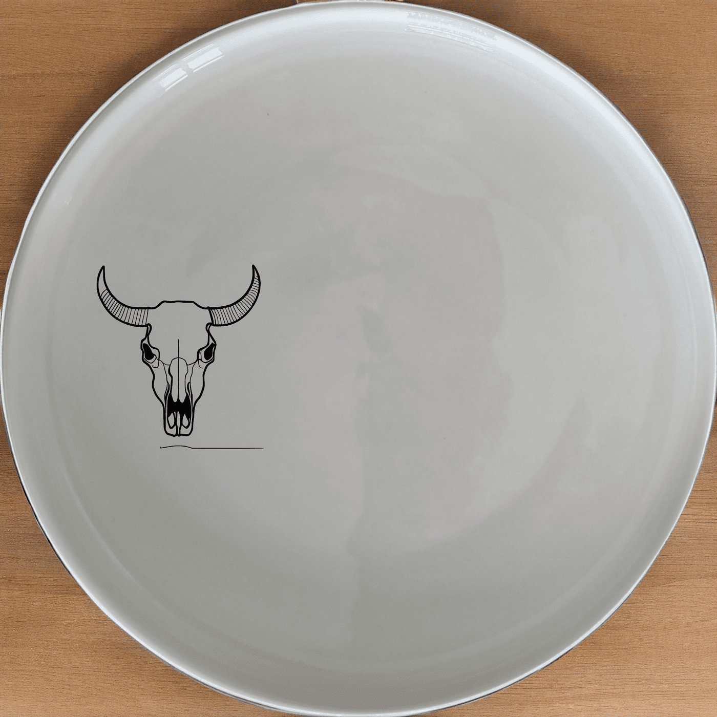 The Front Facing Cow Skull Dinner Plate Set of 4 adds a bold, artistic touch to your dining experience with its striking skull design.