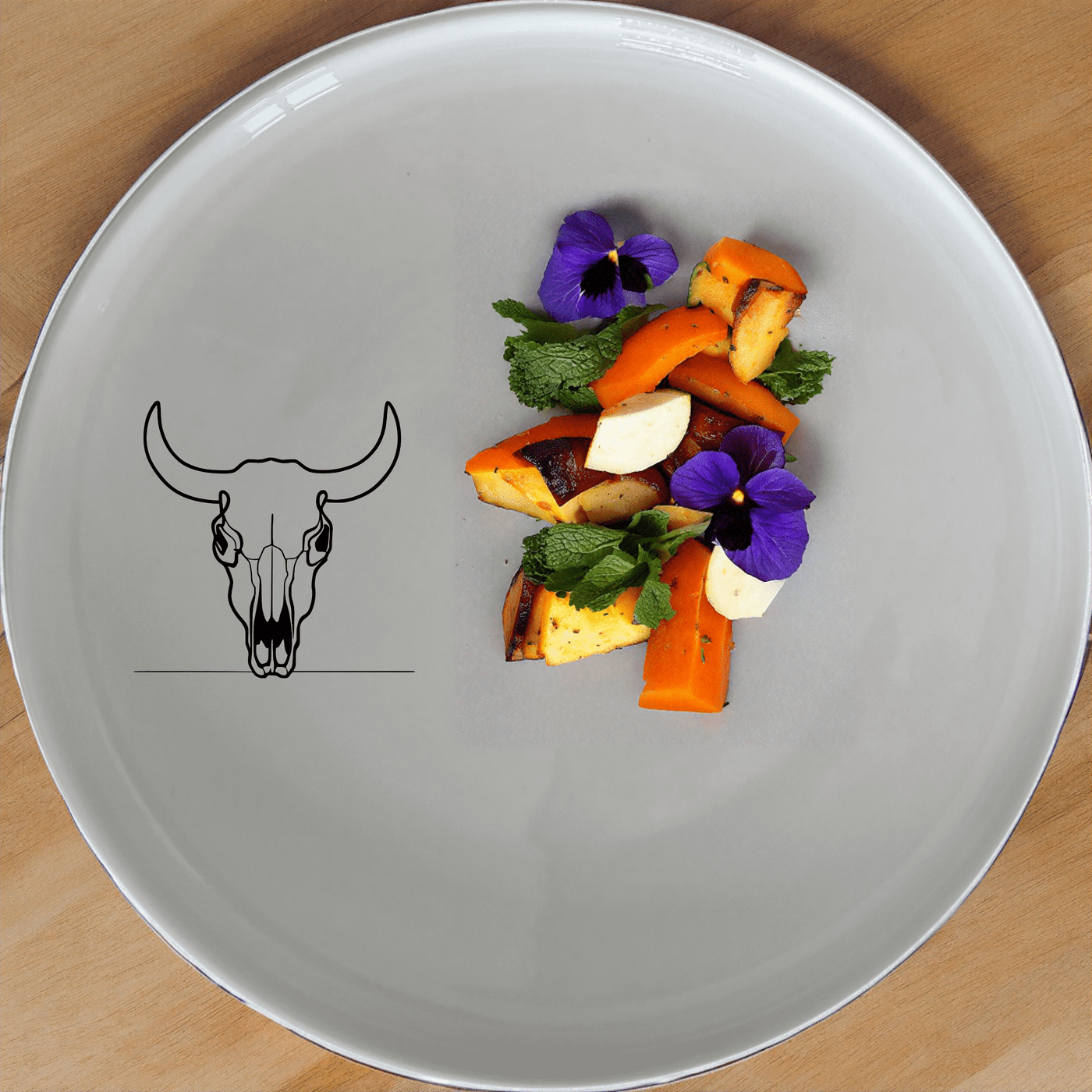 The Front Facing Cow Skull Side Plate Set of 4 adds a bold, artistic touch to your dining table with its striking skull design.