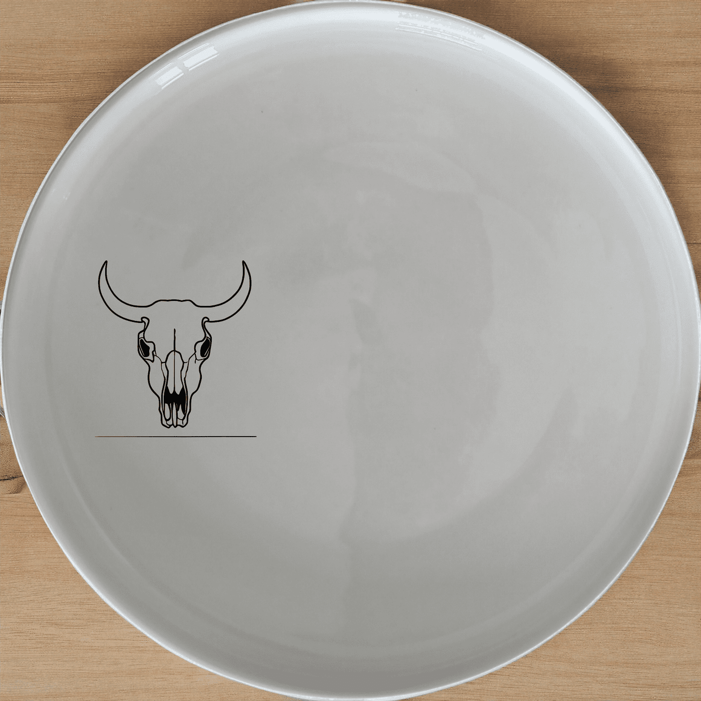 The Frontfacing Cow Skull Side Plate Set of 4 adds a bold, artistic touch to your dining experience with its striking skull design.