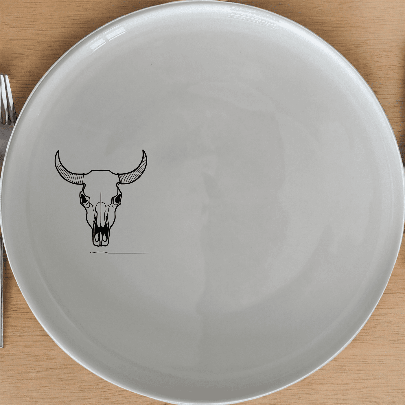 The Front Facing Cow Skull Side Plate Set of 4 adds a bold, artistic touch to your dining table with its striking skull design.