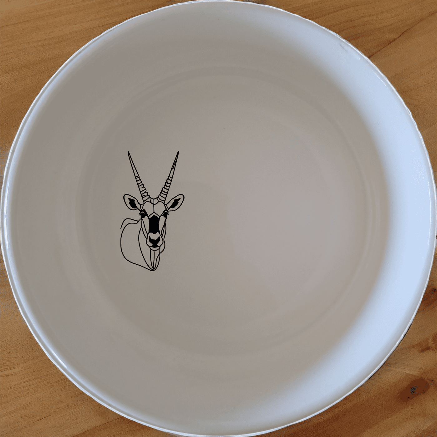 The Gemsbok Bust Bowl Set of 4 features elegant laser-etched designs perfect for modern dining. Crafted from premium ceramic, these bowls offer durability and style for everyday use.