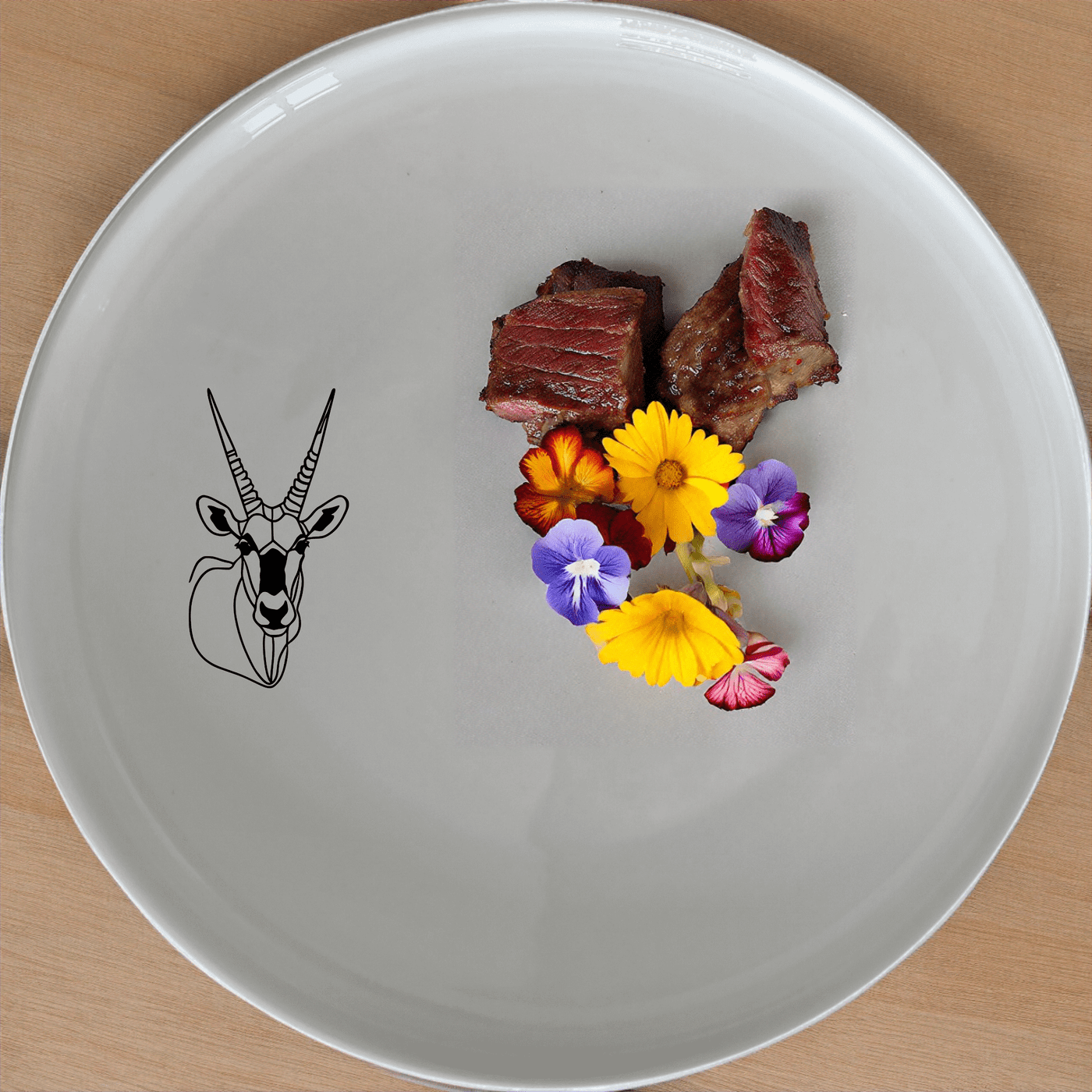 The Gemsbok Bust Dinner Plate Set of 4 features a striking silhouette of the African antelope, perfect for modern dining settings.