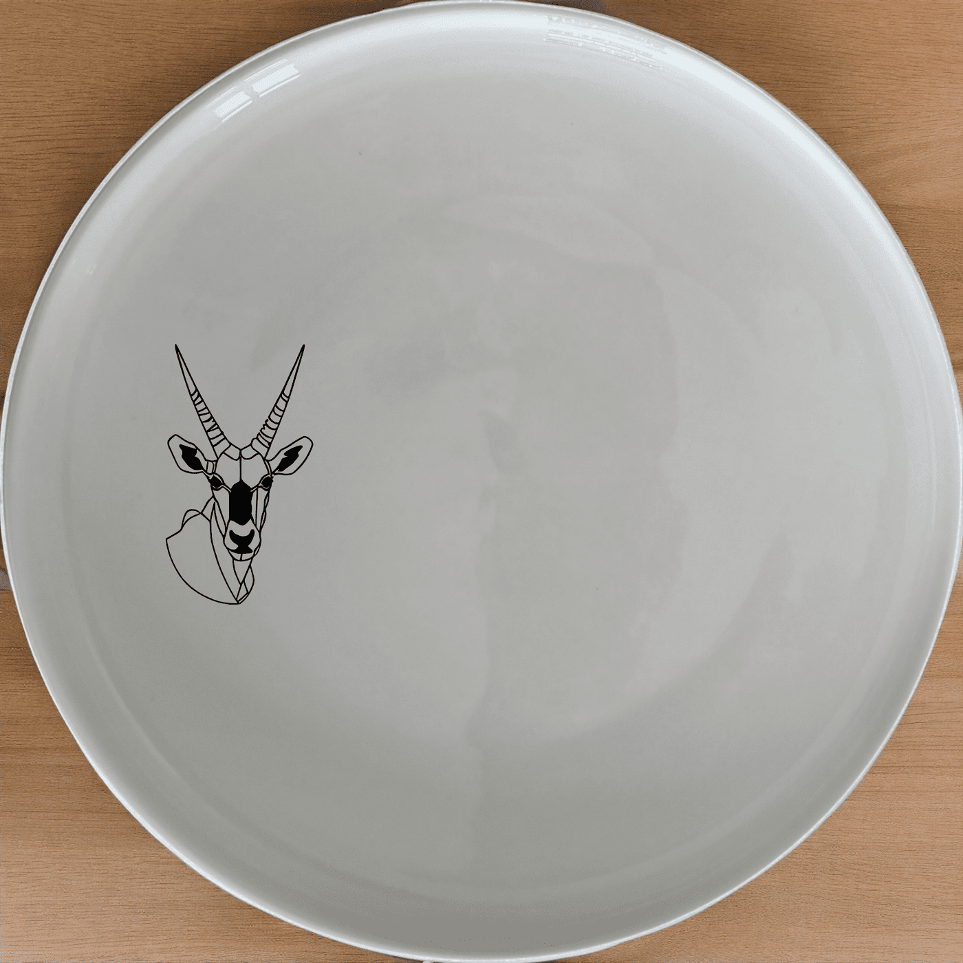 The Gemsbok Bust Side Plate Set of 4 features a striking silhouette design, perfect for modern dining settings.