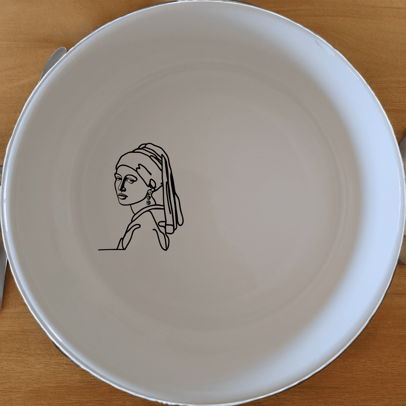 The Girl Pearl Earring Bowl Set of 4 features a minimalist design inspired by classic art, perfect for modern dining and everyday use.