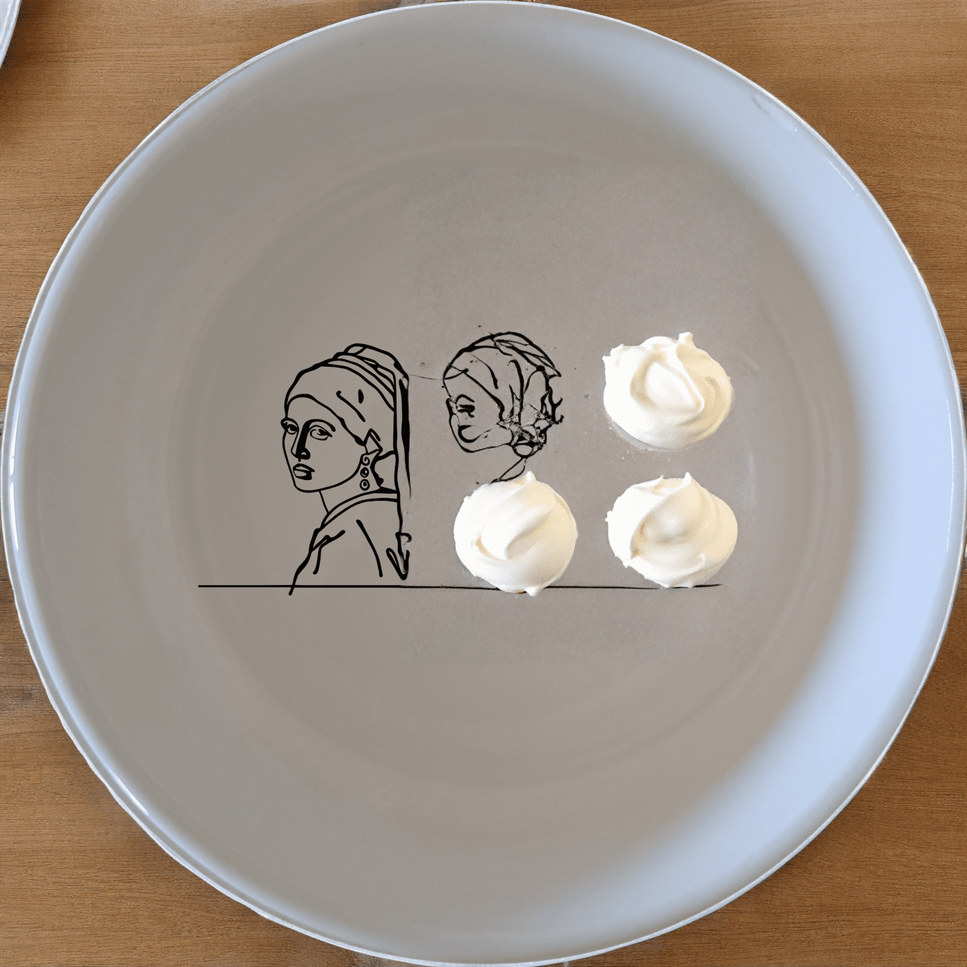 The Girl Pearl Earring Bowl Set of 4 features a minimalist design with a subtle artistic touch, perfect for everyday use or special occasions.