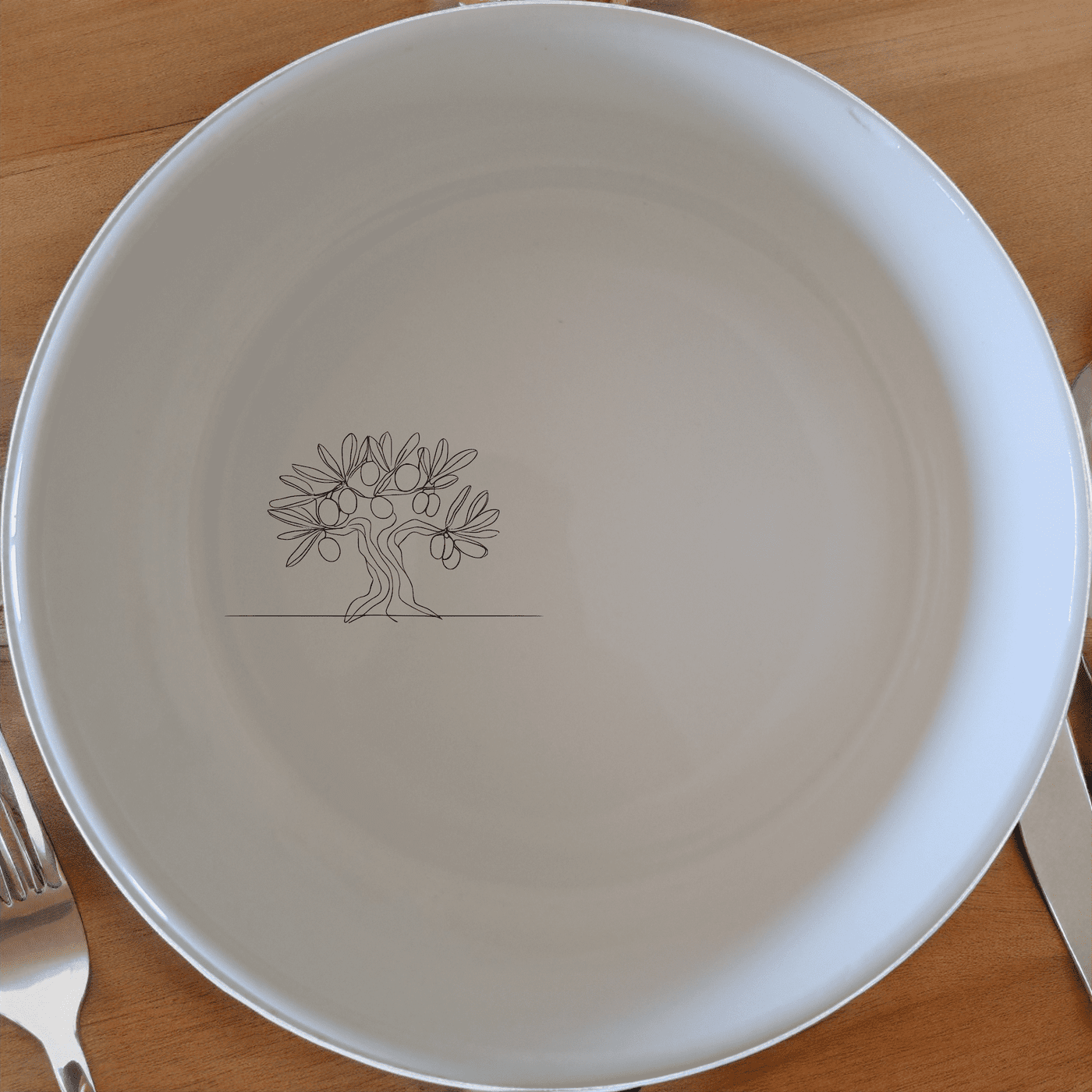 The Grecian Olive Tree Bowl Set of 4 features a minimalist olive tree design, perfect for everyday use or special occasions.