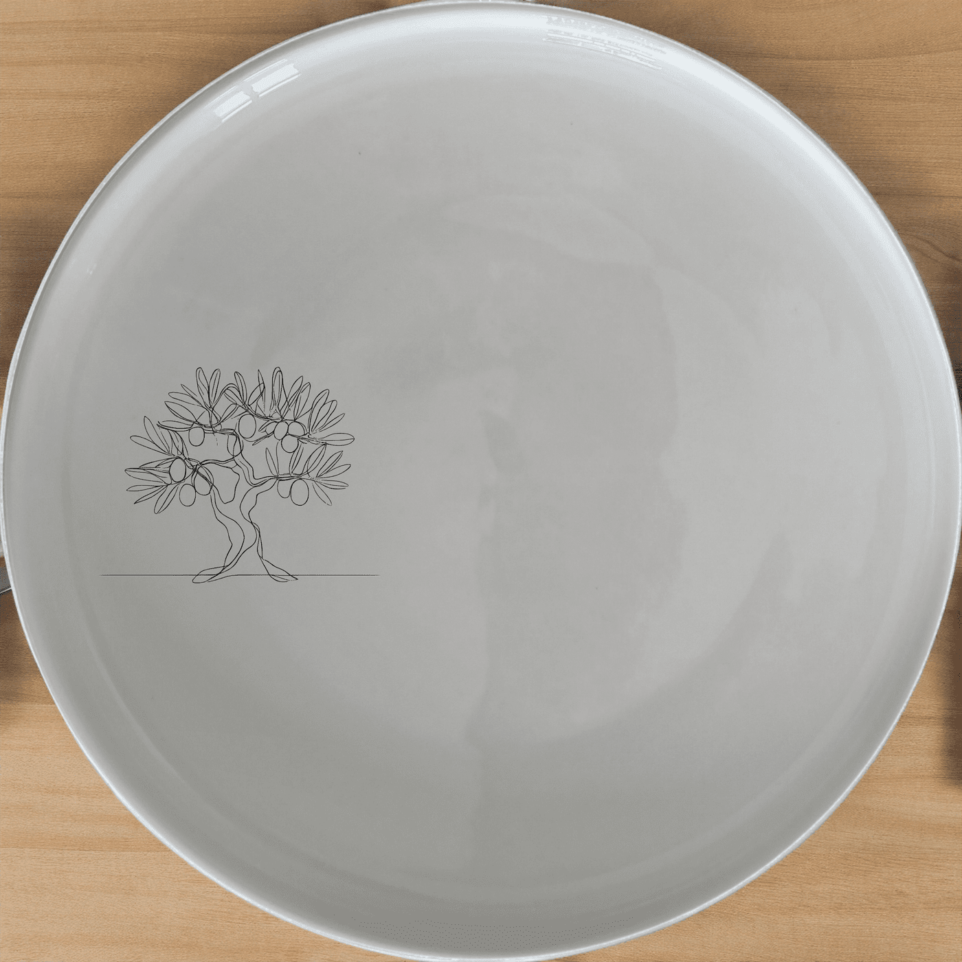 The Olive Tree Side Plate Set of 4 features a minimalist olive tree design, perfect for adding a touch of nature to your dining experience.