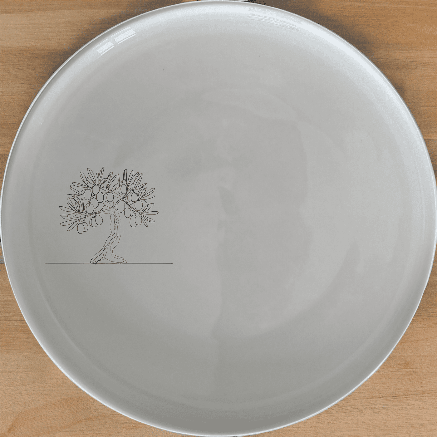 The Olive Tree Side Plate Set of 4 adds a touch of Mediterranean charm to your dining table with its elegant olive tree design.