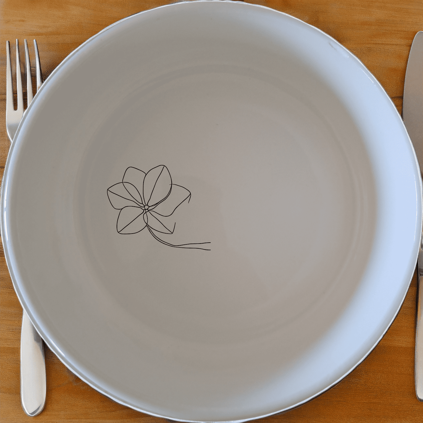 Floral Etched Bowl Set of 4 offers a modern, minimalist design perfect for everyday use or special occasions. This set of four white ceramic bowls features a subtle, laser-etched floral design, adding a touch of elegance to your dining table.