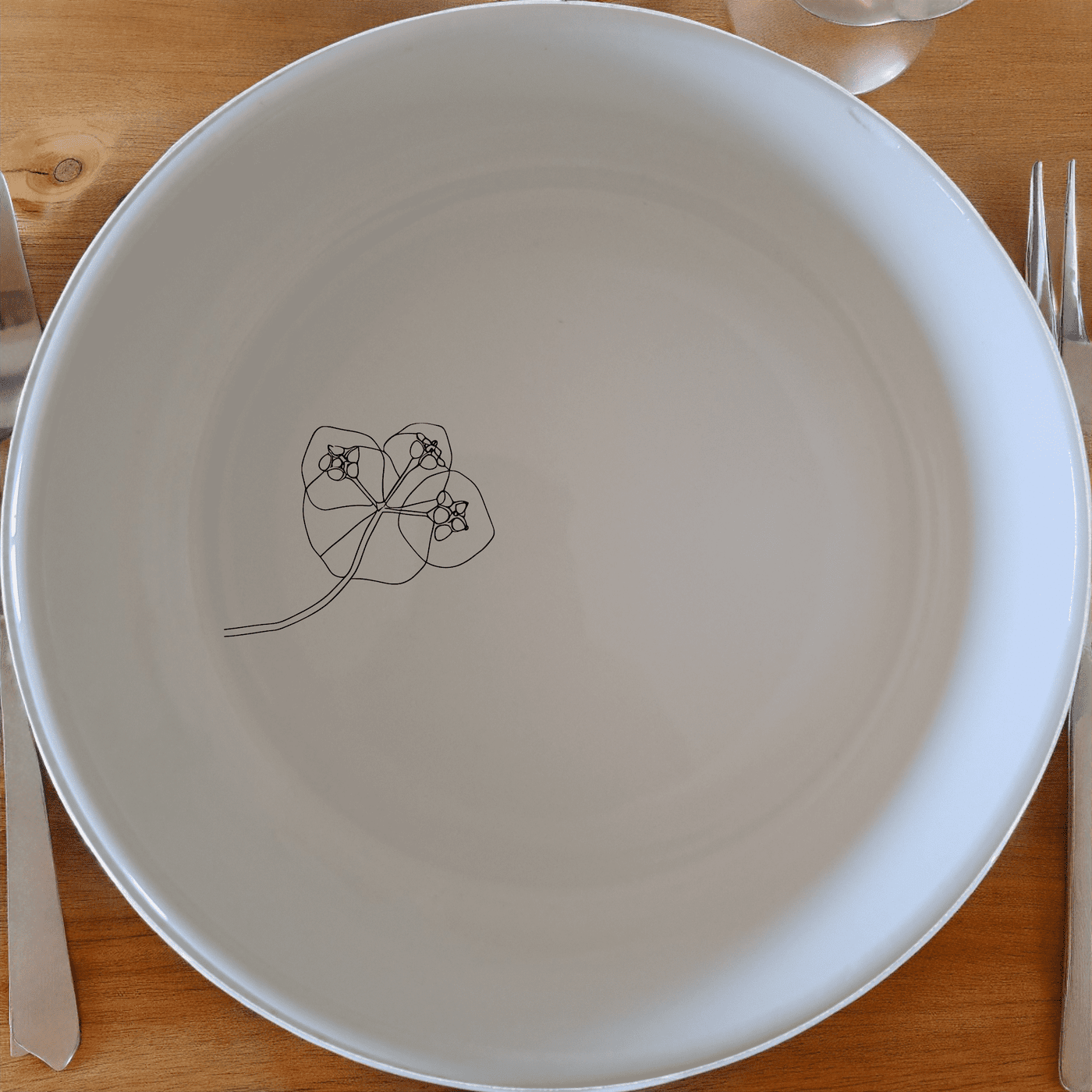 The Hoya Carnosa Bowl Set of 4 features delicate laser-etched designs on white ceramic, perfect for everyday use or special occasions.