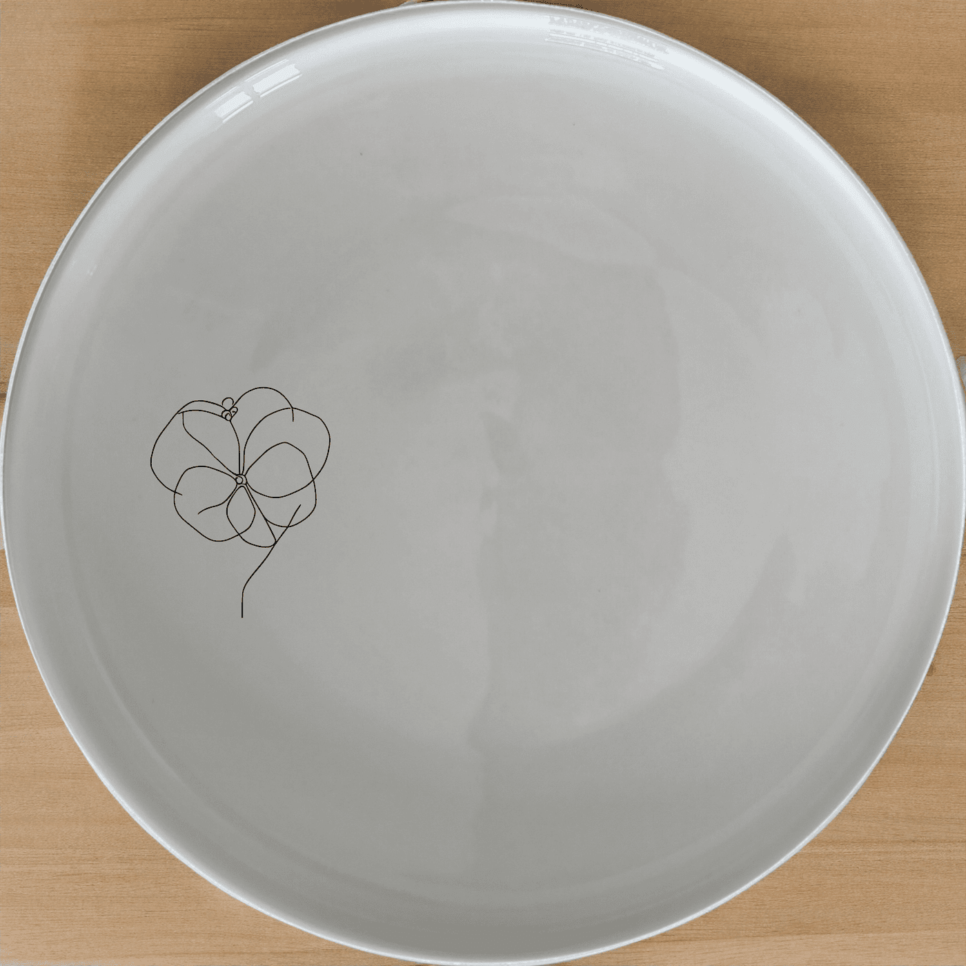 The Hoya Carnosa Dinner Plate Set of 4 features a delicate floral design, perfect for elevating any dining experience with its timeless elegance.