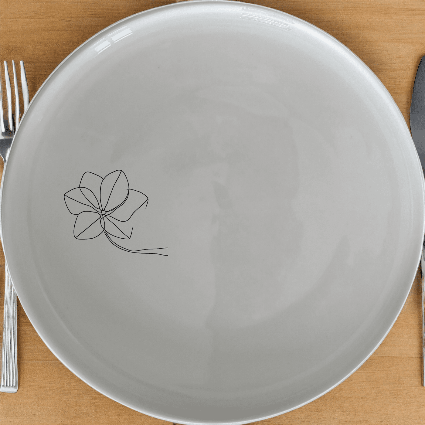 The Hoya Carnosa Side Plate Set of 4 adds a touch of nature to your dining table with its delicate floral design.