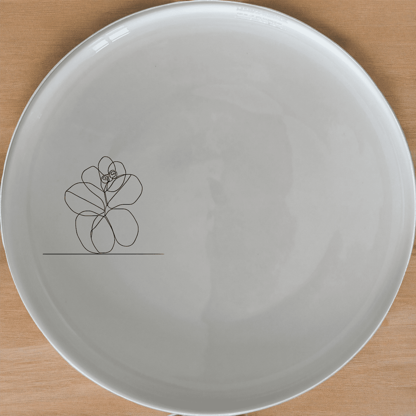 The Hoya Carnosa Side Plate Set of 4 features a delicate laser-etched design, perfect for adding a touch of elegance to any dining table.