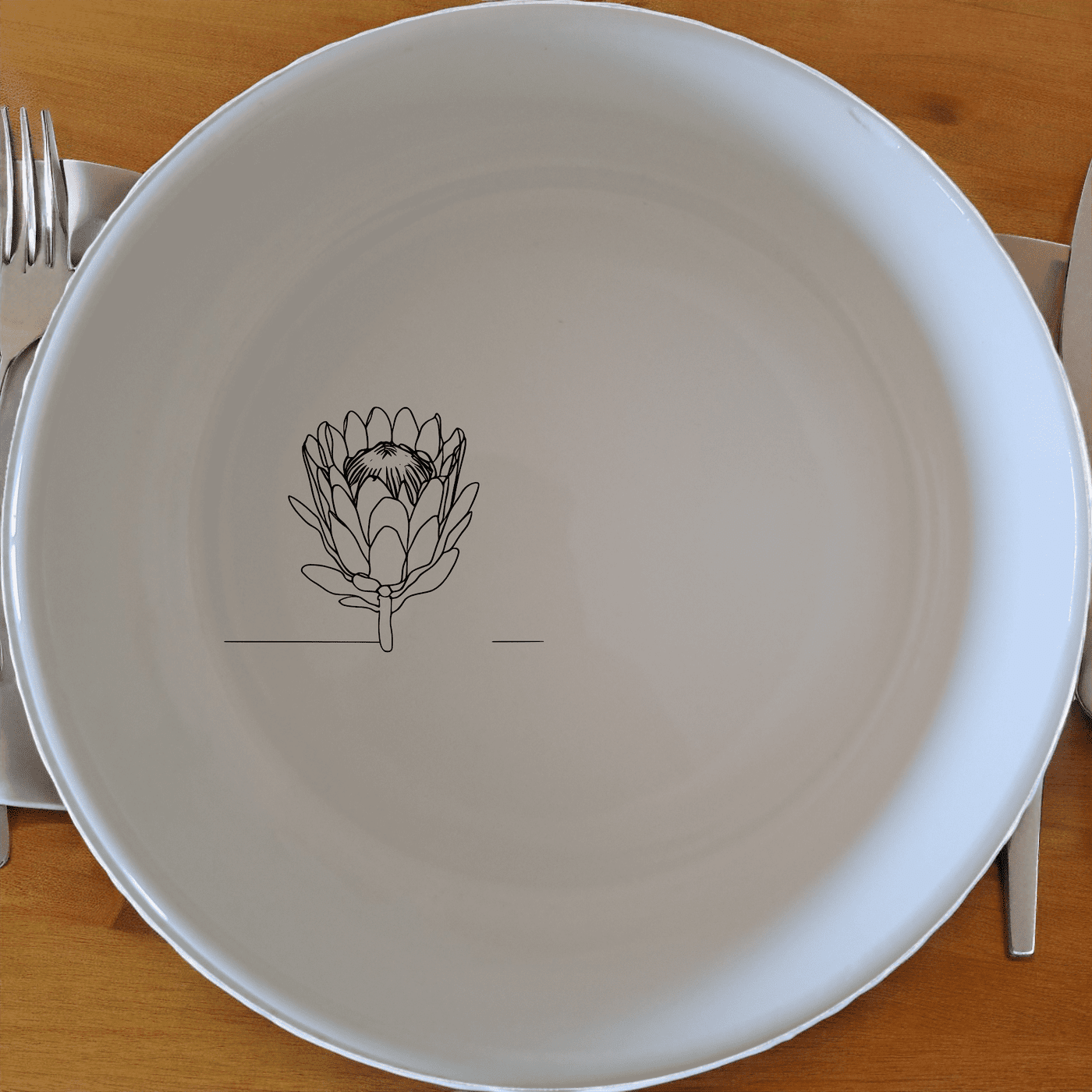 The King Protea Flower Bowl Set of 4 features a botanical illustration of the iconic King Protea flower, making it a perfect addition to any dining collection.