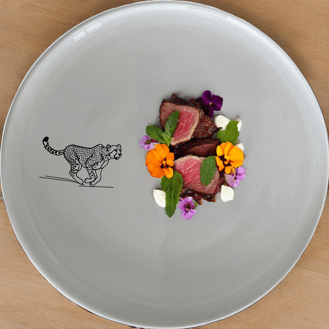 The Running Cheeta Dinner Plate Set of 4 - Range 4 features a sleek cheetah design, perfect for modern dining. Crafted from durable ceramic, these plates are microwave and dishwasher safe, making them ideal for everyday use.