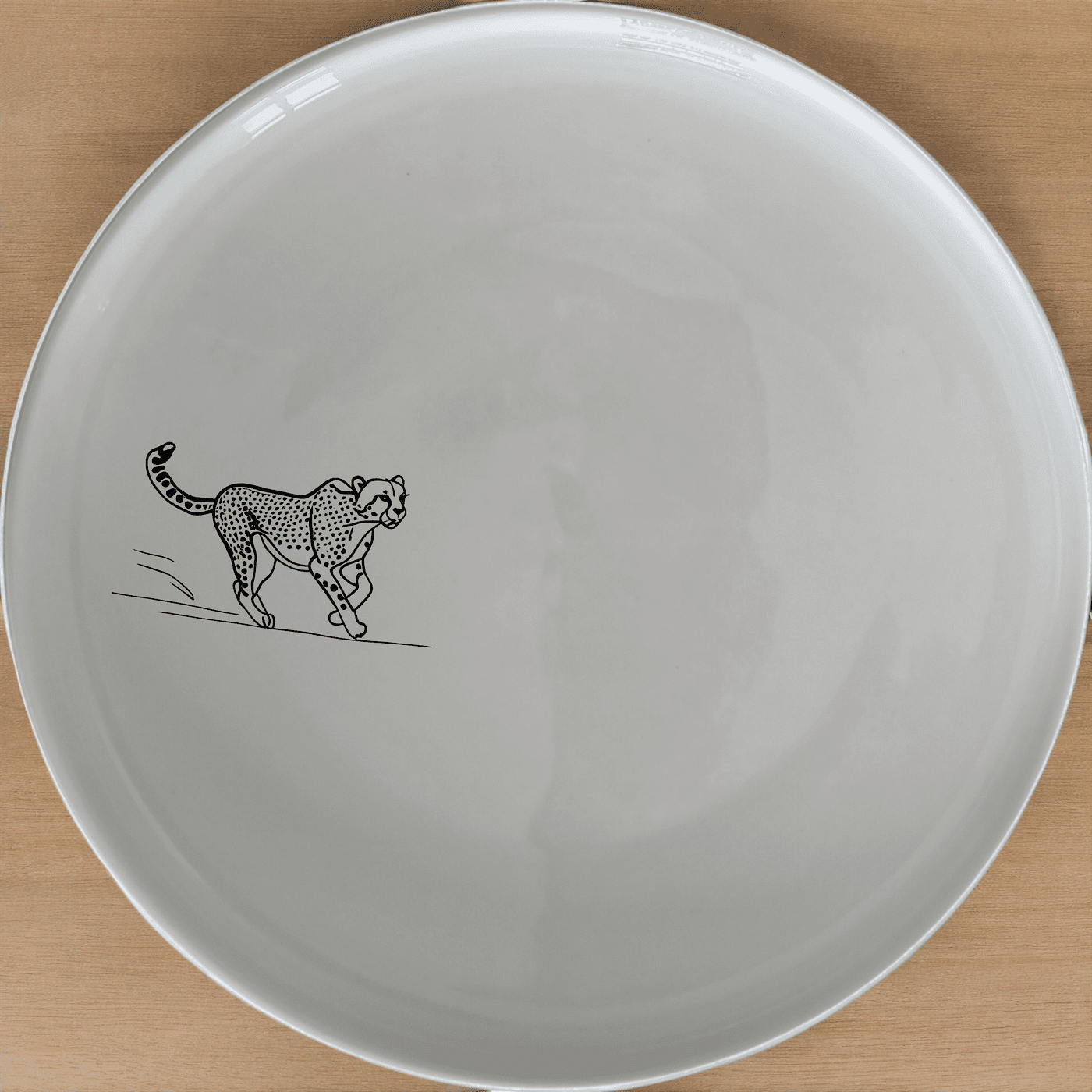 The Kruger Park Running Cheeta Side Plate Set of 4 - Range 2 features a sleek cheetah design, perfect for modern dining and everyday use.