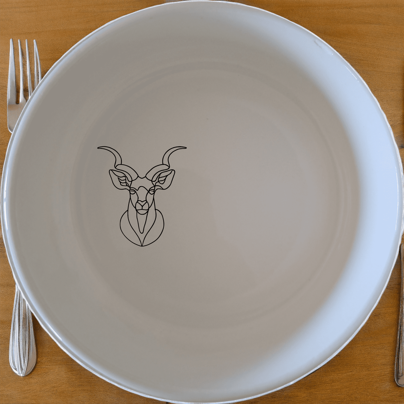 The Kudu Spiral Horns Majestic Bowl Set of 4 adds a touch of wildlife elegance to your dining table with its sleek design and durable ceramic construction.