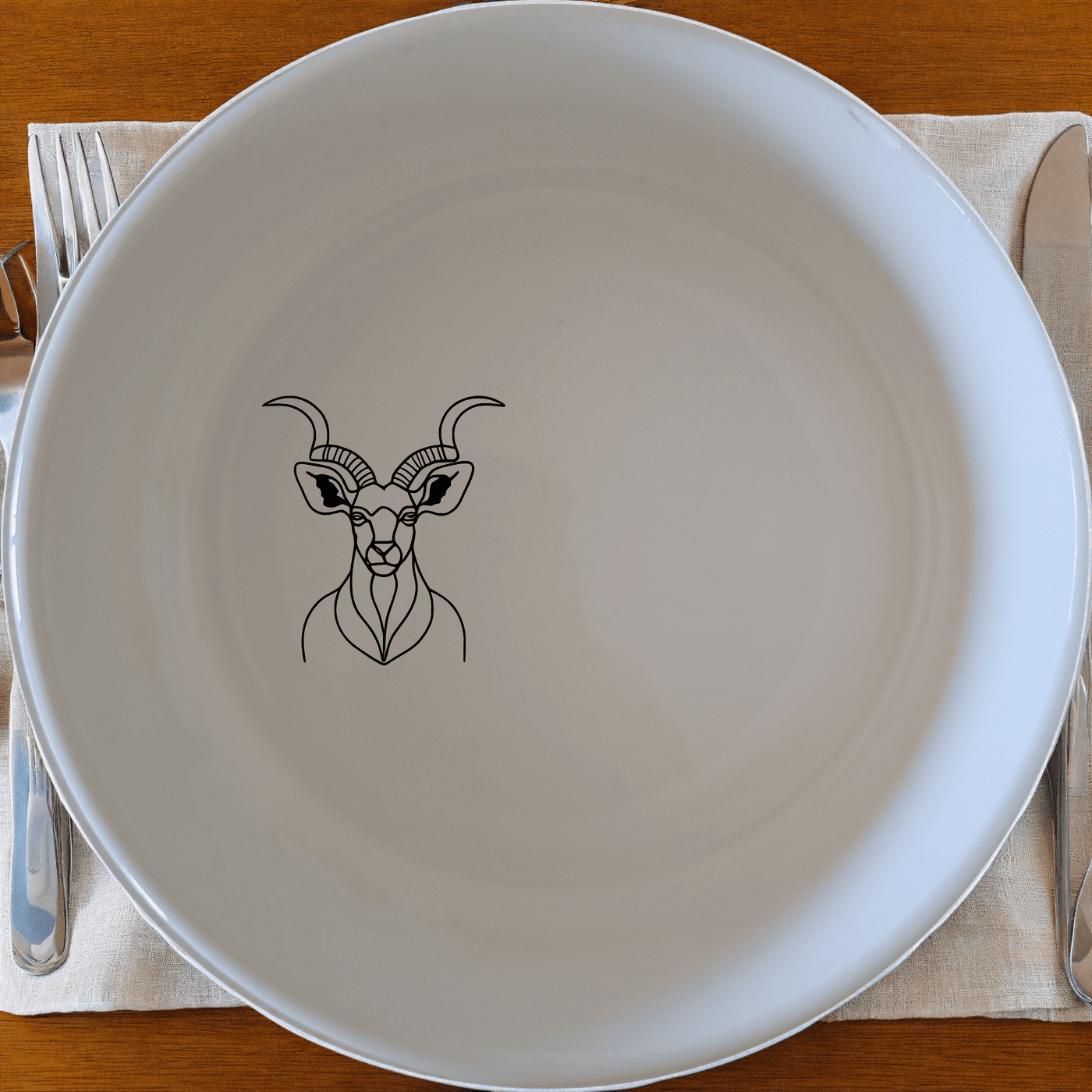 The Kudu Spiral Horns Majestic Bowl Set of 4 features elegant wildlife designs perfect for any dining table.