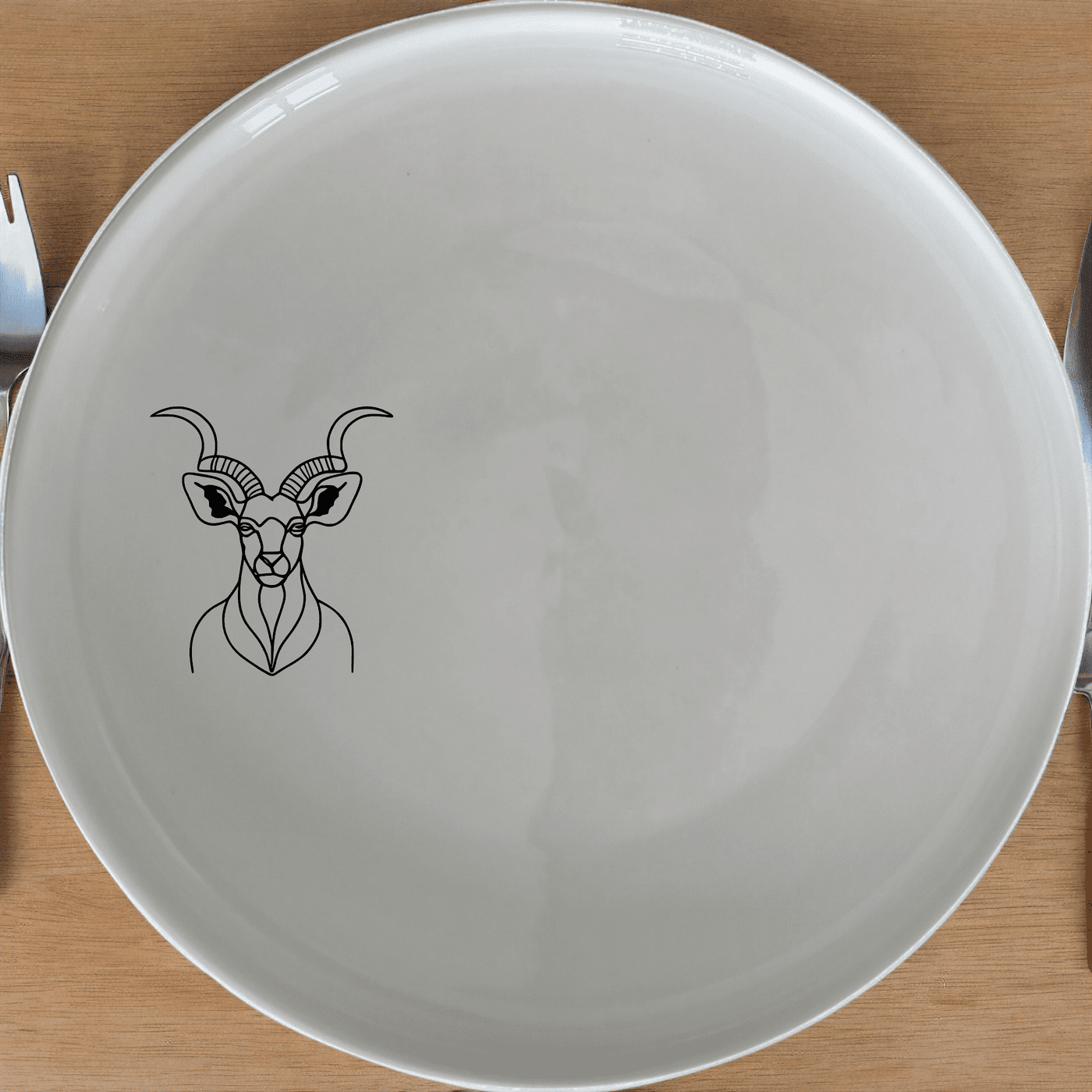 The Majestic Kudu Spiral Horns Dinner Plate Set of 4 adds a touch of wildlife elegance to your dining table with its sleek design and high-quality ceramic construction.