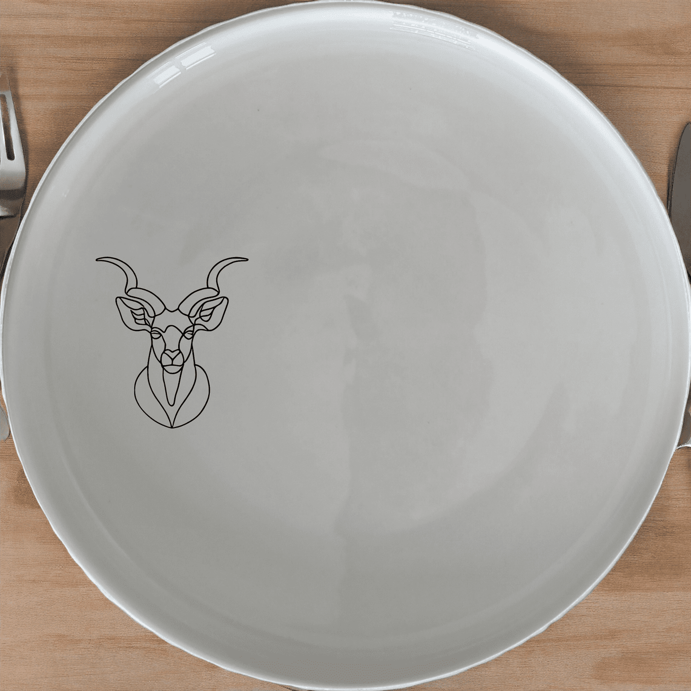 Spiral Horns Majestic Bust Side Plate Set of 4 adds a touch of elegance to your dining table with its unique design and high-quality ceramic construction.