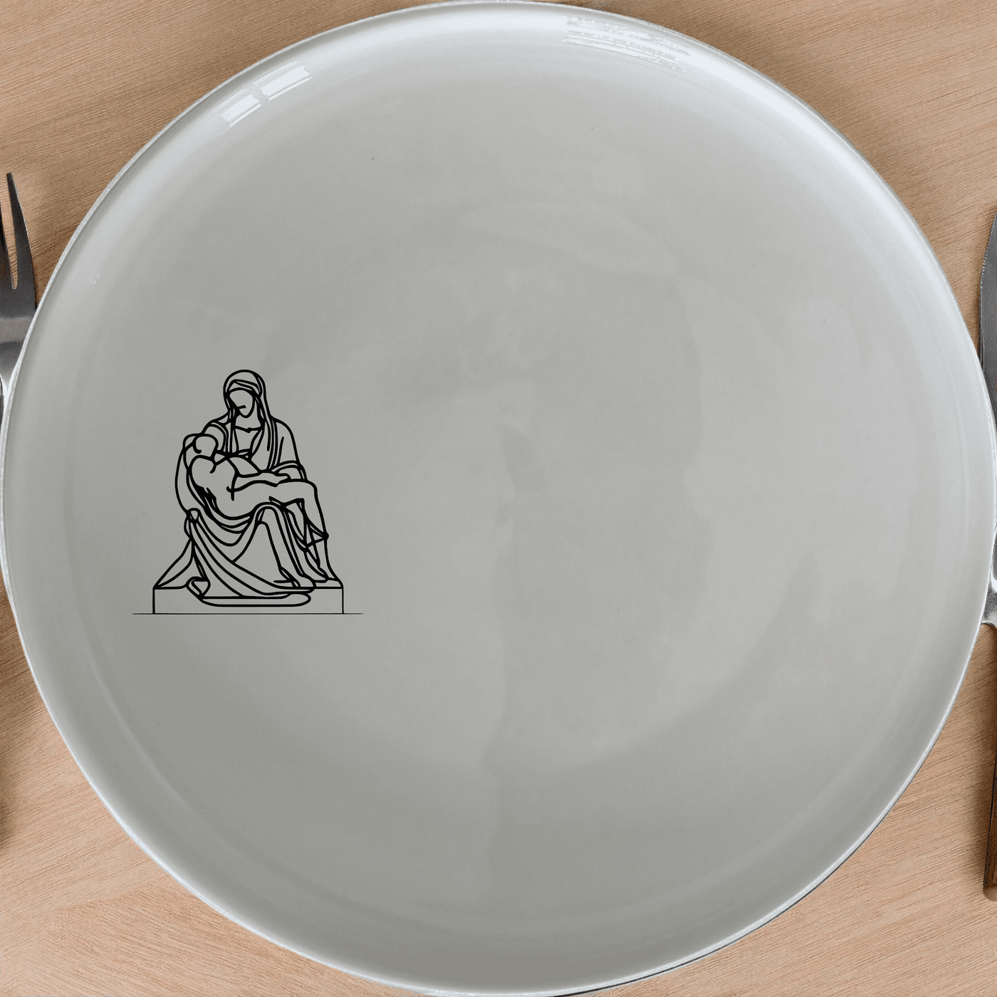 The Pieta Art Dinner Plate Set of 4 brings classical artistry to your dining table with intricate laser-etched details.