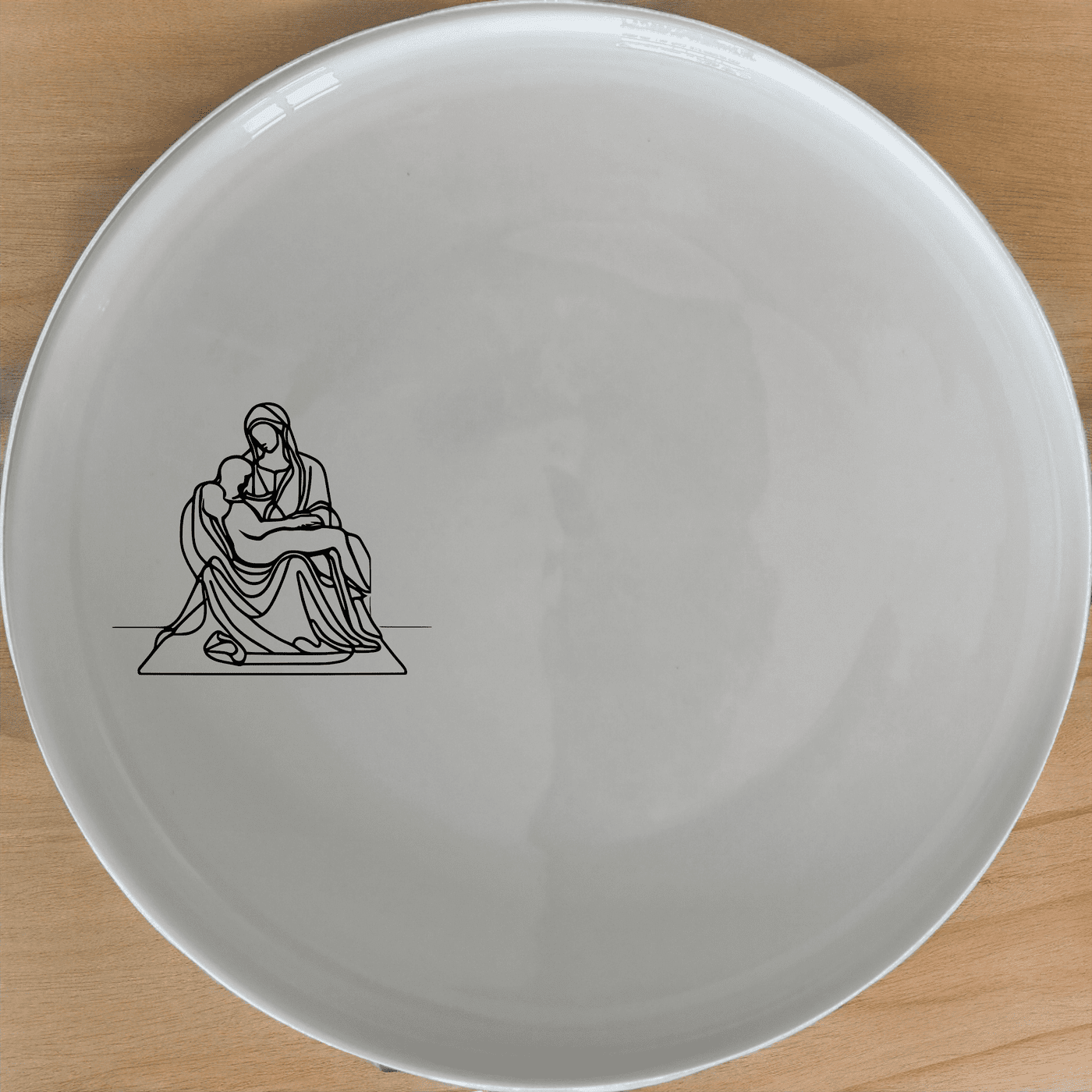 The Pieta Art Side Plate Set of 4 - Range 1 features a timeless design inspired by classical art, perfect for elevating any dining experience.