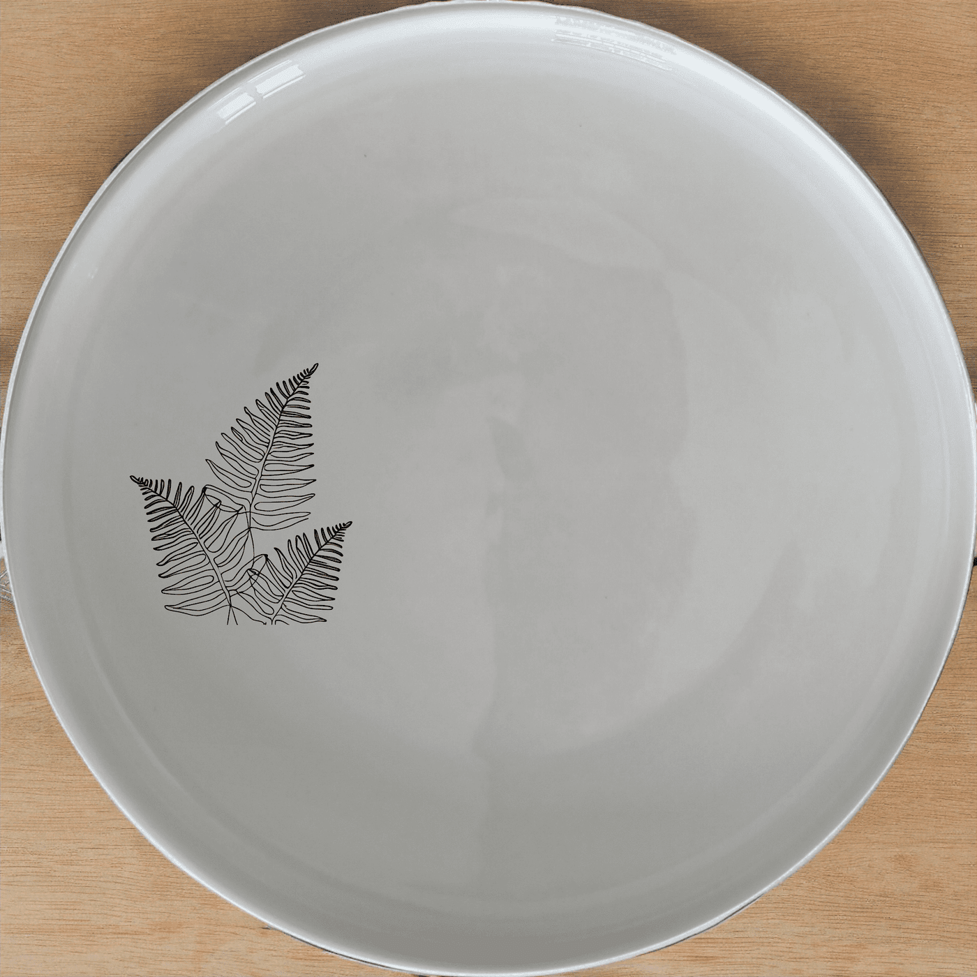 The Layered Fern Fronds Dinner Plate Set of 4 adds a touch of nature to your dining table with its elegant fern design.