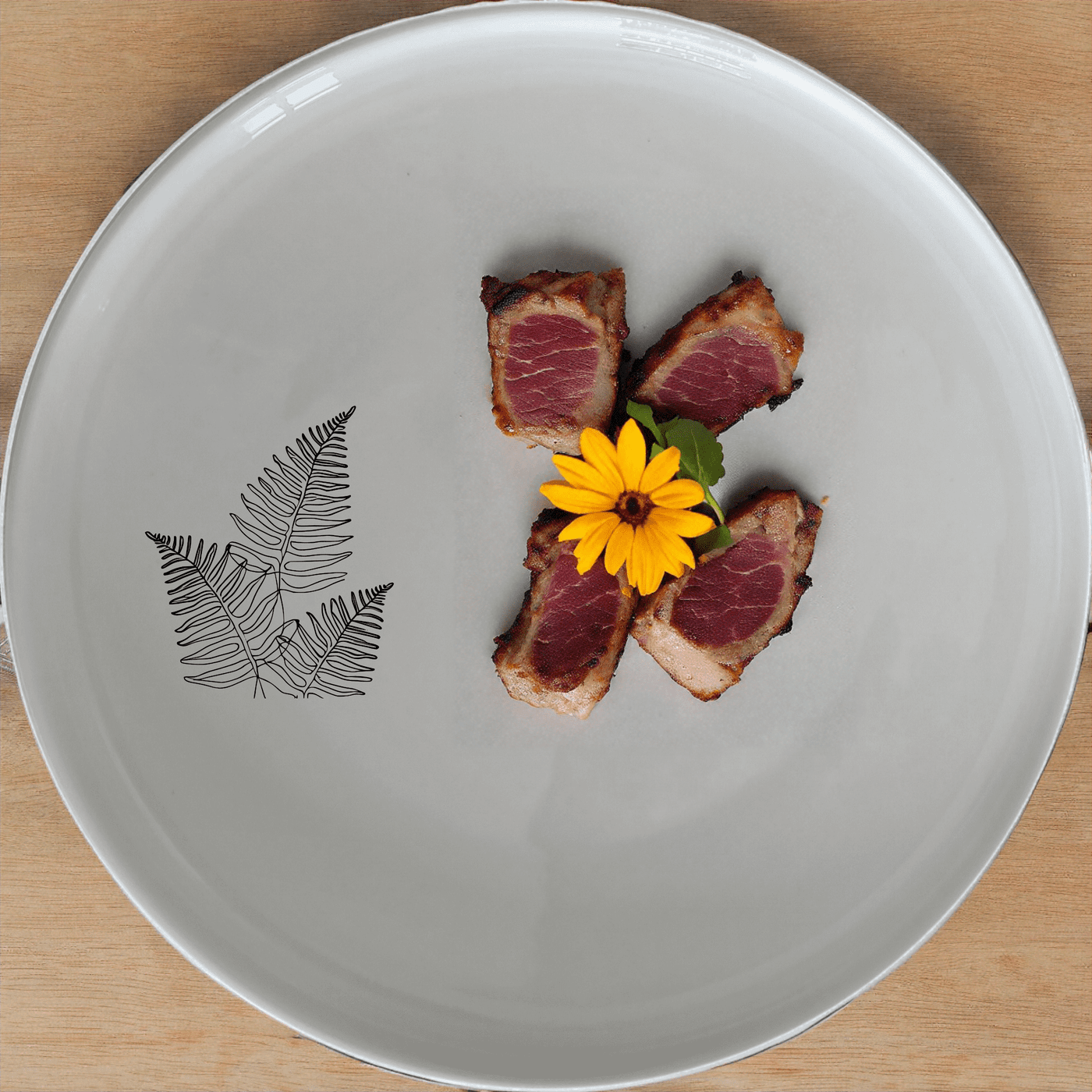The Layered Fern Fronds Dinner Plate Set of 4 adds a touch of nature to your dining table with its elegant fern design.