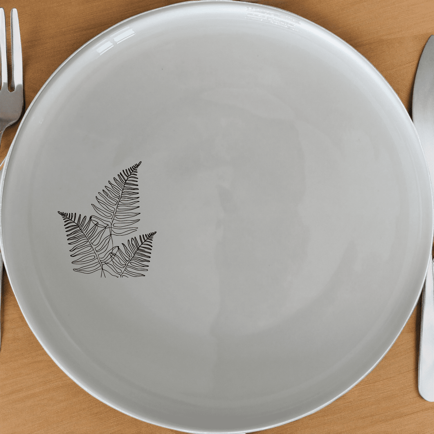 The Layered Fern Fronds Side Plate Set of 4 adds a touch of nature to your dining table with its elegant fern design.