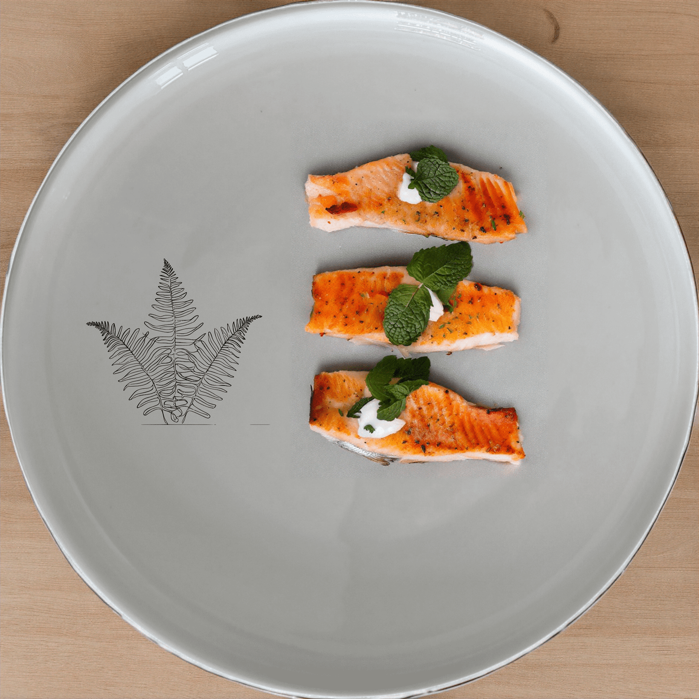 The Layered Fern Fronds Side Plate Set of 4 features a minimalist fern design, perfect for adding a touch of nature to your dining table.