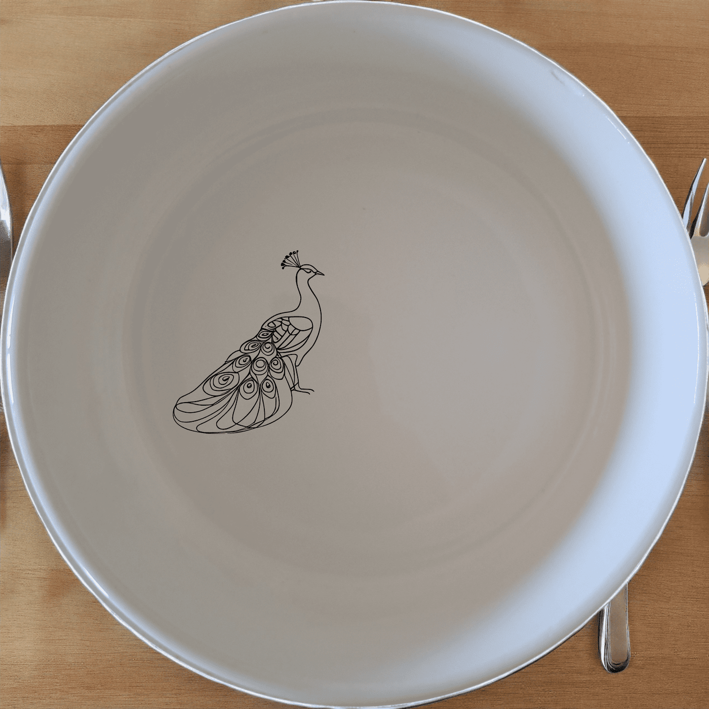 The Male Peacock Bowl Set of 4 adds an artistic touch to your dining experience with its elegant design and versatile use.