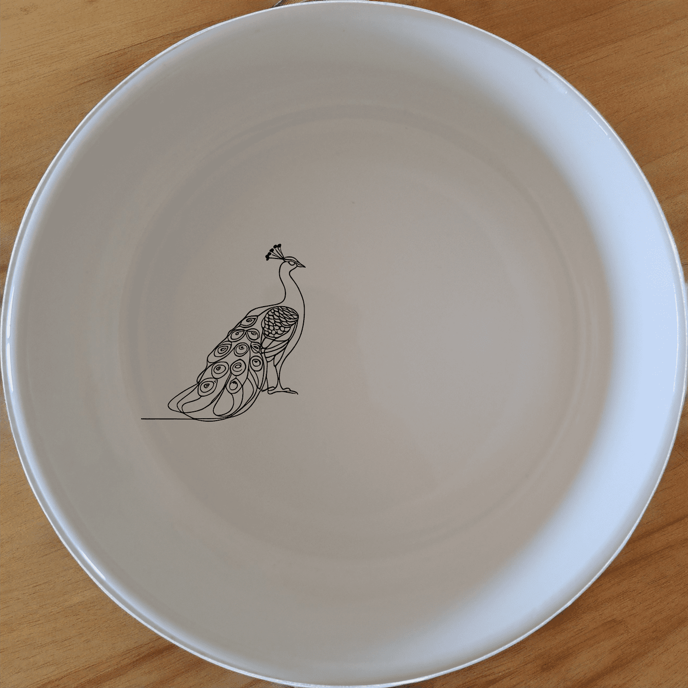 The Male Peacock Bowl Set of 4 features elegant designs perfect for any dining occasion.