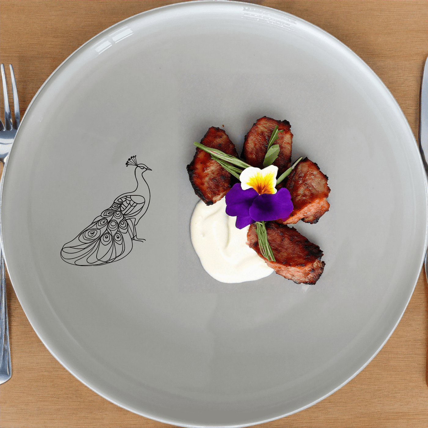 The Male Peacock Dinner Plate Set of 4 adds a touch of elegance to any dining table with its intricate design and classic white ceramic finish.