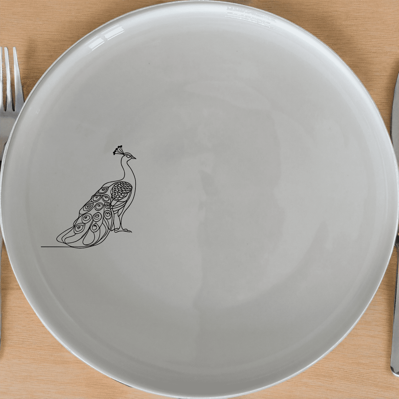 The Male Peacock Dinner Plate Set of 4 features a striking silhouette design, perfect for elevating any dining experience.