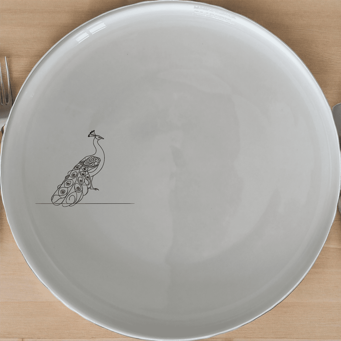 The Male Peacock Side Plate Set of 4 adds a touch of sophistication to any dining table with its elegant design and timeless appeal.