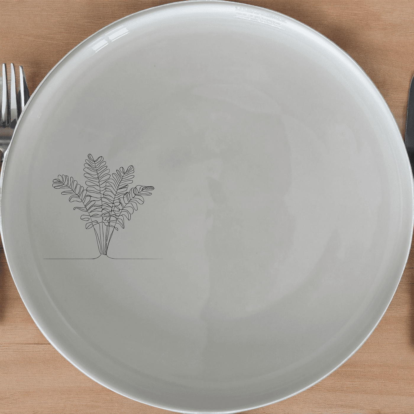 The Maximalism Cycads Dinner Plate Set of 4 adds a touch of modern elegance to your dining table with its sleek design and botanical motif.