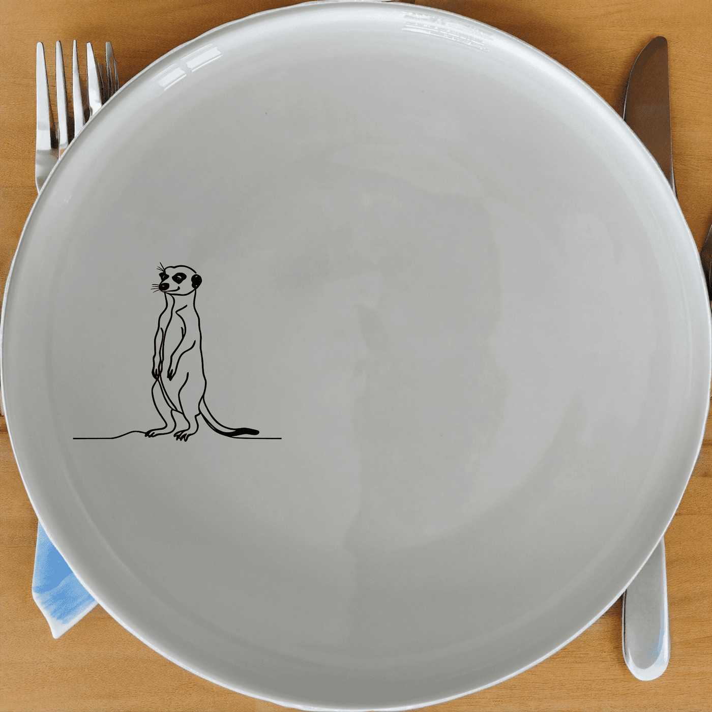 The Meerkat Standing Hind Legs Side Plate Set of 4 features a minimalist design perfect for modern dining. Each plate showcases a charming meerkat illustration, adding a touch of whimsy to your table setting.