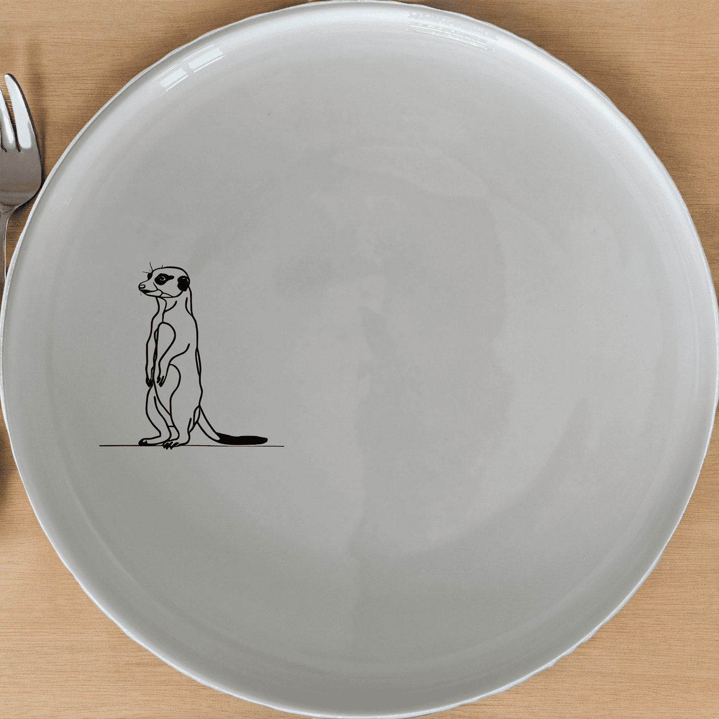 The Standing Meerkat Side Plate Set of 4 adds a whimsical touch to your dining table with its charming design.