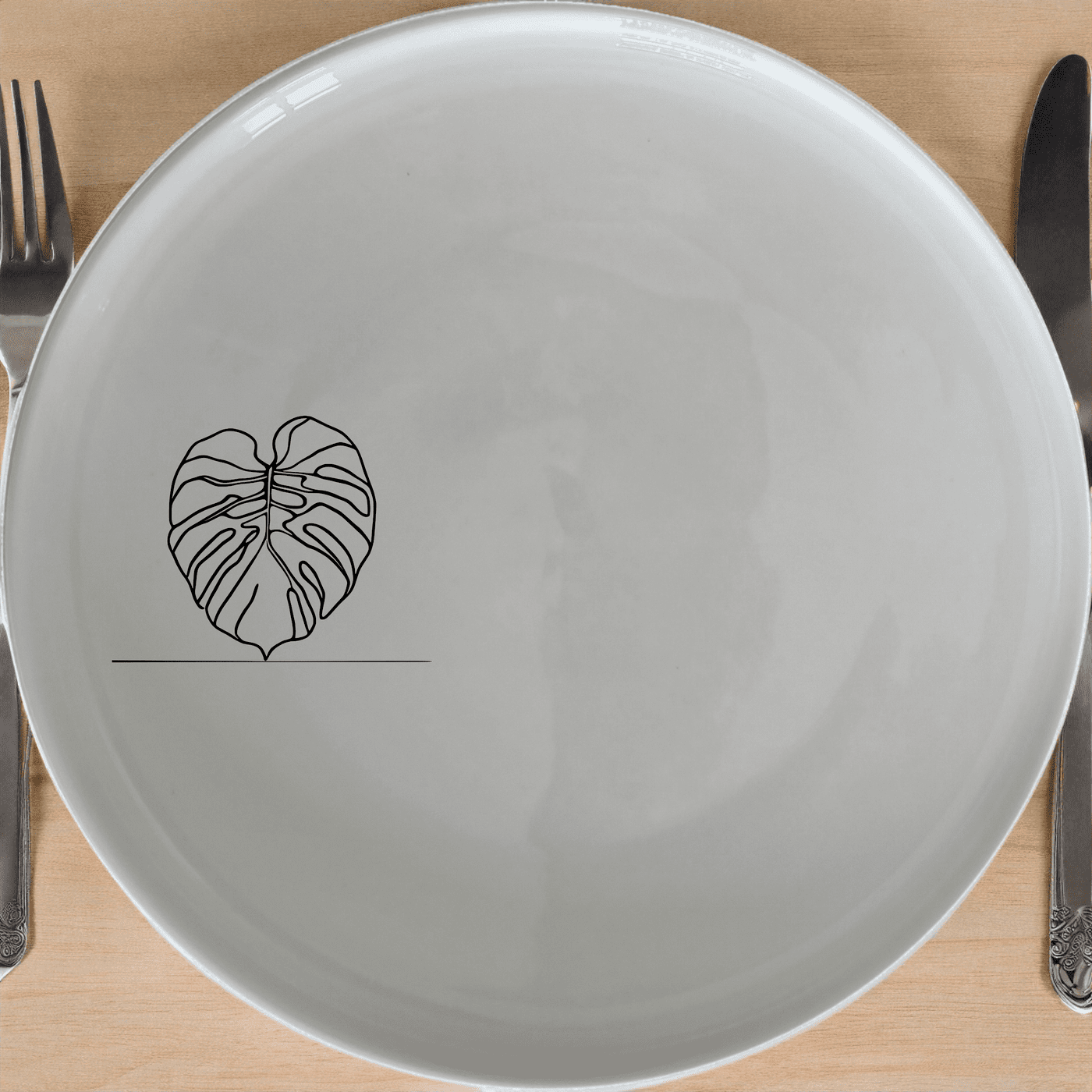 Monstera Deliciosa Side Plate Set of 4 is a stunning collection of four elegant ceramic plates, perfect for adding a touch of nature to your dining experience.