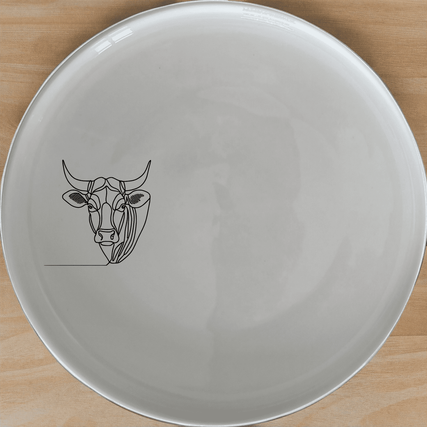 The Nguni Cattle Cow Dinner Plate Set of 4 features a striking silhouette design, perfect for modern and rustic dining settings.