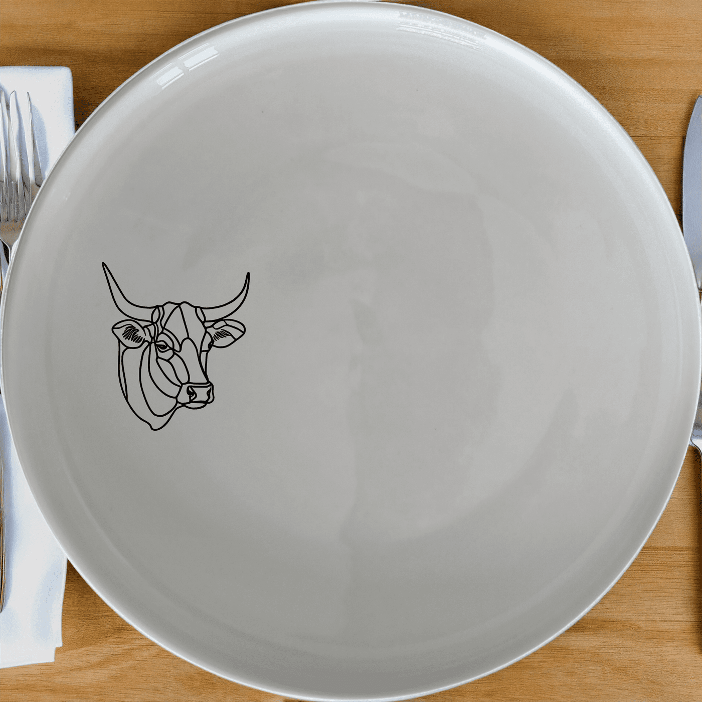 The Nguni Cattle Cow Dinner Plate Set of 4 features a striking silhouette design, perfect for modern and rustic dining settings.